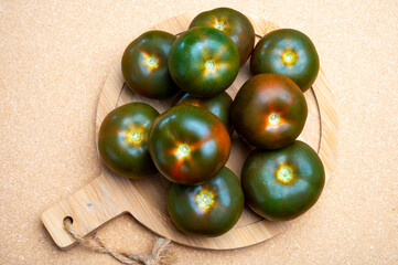 Fresh ripe sweet reddish brown and green kumato tomatoes