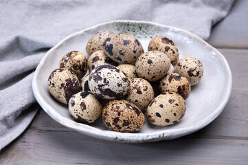 Fresh small spotted partridge or quail bird eggs