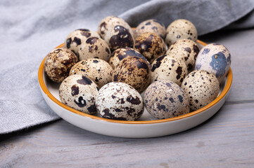 Fresh small spotted partridge or quail bird eggs