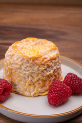 French Langres soft cows crumbly cheese with washed rind structure made in Champagne - Ardenne...