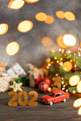Wooden numbers 2023, toy car carries the number 3