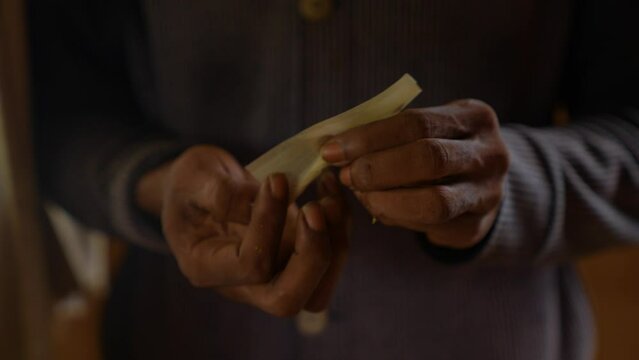 Rastafarian rolled up a joint, (which can also mean specifically a joint that has tobacco mixed with cannabis), "doobie" or "doob", is a rolled cannabis cigarette.