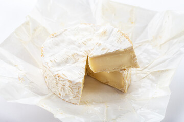 Camembert cheese on white background.