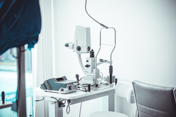 Different devices for measuring diopter and eye examination. Visit at the ophtalmologist, eye doctor, with all devices and appliances. Laser surgery.