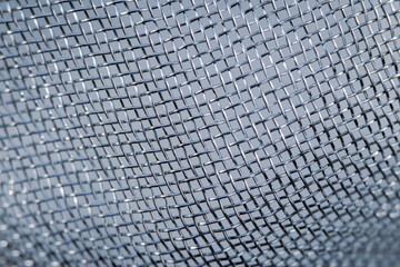 Close up of mesh on metal sieve