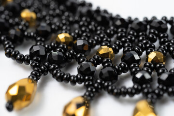 handmade colorful bead necklace close-up isolated on white background.