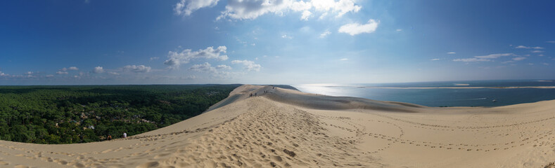 Fototapeta na wymiar Panorama of sandy dune du Pilat, the biggest sand dune in Europe with the pine forest, Arcachon, Nouvelle-Aquitaine, France