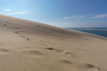 Sand dune, atlantic sea and blue cloudy sky, Dune du Pilat, Arcachon, Nouvelle-Aquitaine, France