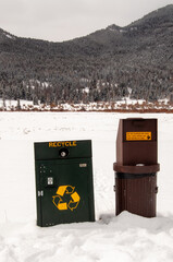 Recycling and Trash Cans in Rocky Mountain National Park, Colorado during the winter, snowy background scene