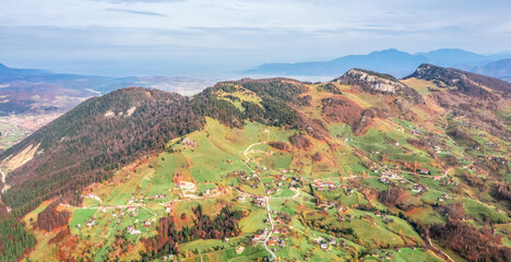 Beautiful landscape aerial view with Carpathian Mountains in Brasov county Romania captured in autumn 