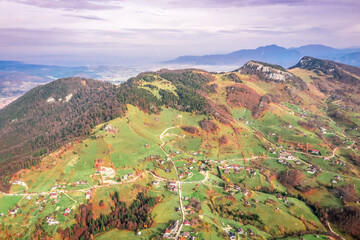 Beautiful landscape aerial view with Carpathian Mountains in Brasov county Romania captured in autumn 