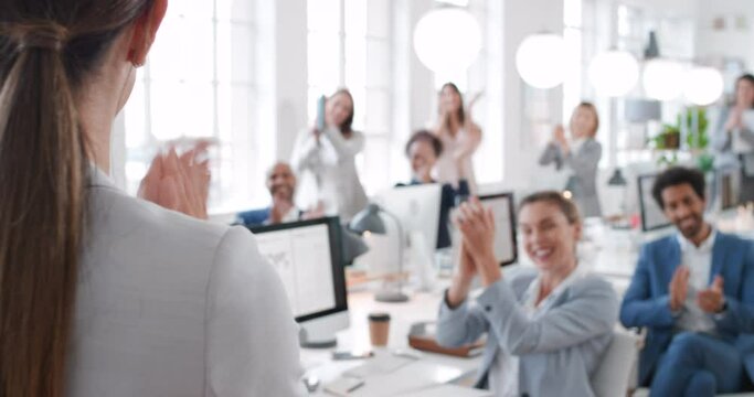 Applause, winner and wow with a female leader, manager or boss and team clapping in the office at work. Meeting, coaching and training with a business woman and colleague group applauding a goal
