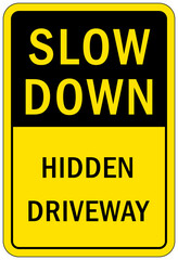 Garage sign and label slow down hidden drive