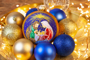 a large decoration for the Christmas tree with the image of the birth of Jesus Christ in Bethlehem....