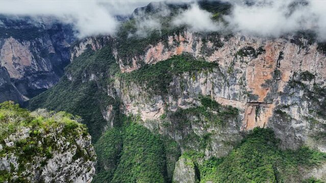Aerial view of the majestic Canyon del Sumidero in Mexico. Flight over the canyon in the clouds.