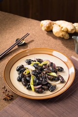 Stir-fried cocoon pupae is a special food in northeast China