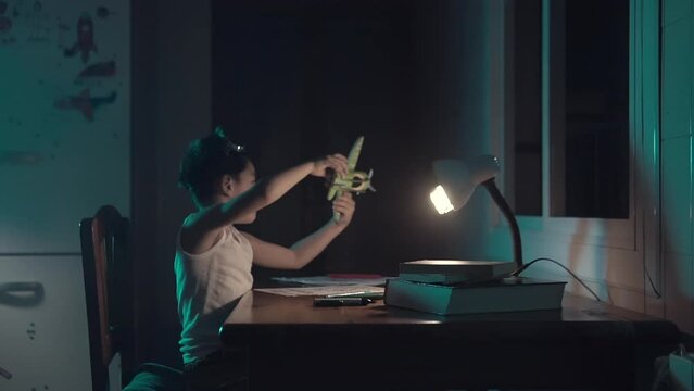 Kid Playing Pretend With A Wooden Toy Plane Wearing Googles. Boy Using His Imagination At Home. Child Wants To Be A Pilot.