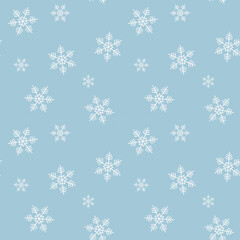 Seamless pattern with snowflakes on the blue background