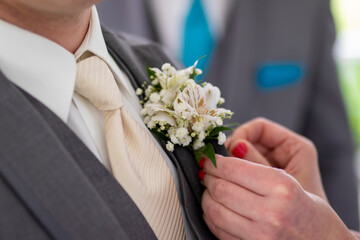 groom with wedding boutonnière 