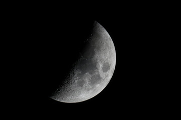 Close up of a waxing half moon as seen on Nov 29, 2022 - obrazy, fototapety, plakaty