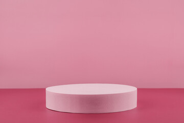 Podium pedestal showcase for cosmetic product presentation, minimal abstract pink background for cosmetics perfume and jewellery minimalist display. Empty stage for beauty products. Front view