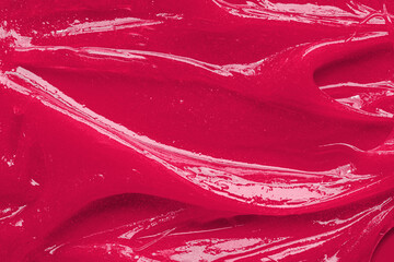 Color of the year 2023 Viva magenta. Red gel texture. Cosmetic clear liquid cream smudge. Skin care product sample closeup. Toothpaste or wax background - obrazy, fototapety, plakaty