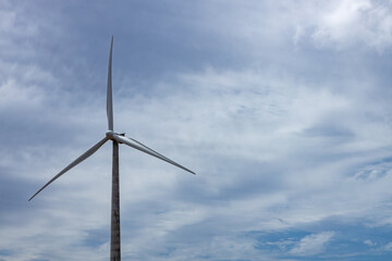 Fototapeta premium A huge electricity generator with wind with its three blades.