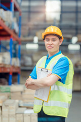 Portrait asian engineer in helmets order on tablet for checking goods and supplies on shelves with goods background in warehouse.logistic  business export ,Warehouse worker checking packages on store