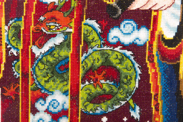 Chinese folk handmade mbroidered good by cross-stitch pattern close up.