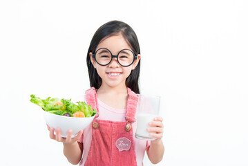 children girl asia eating vegetables and milk
