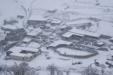View of Galiat village at winter snowfall. Mountain Digoria, North Ossetia, Russia.