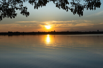 Wooden pier at sunset on a lake in Bueng Kan, Thailand 2022   