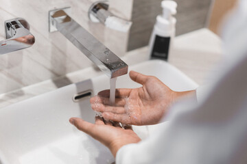 Close up of people washing hand carefully.