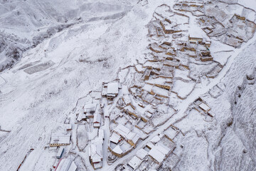 Aerial view of Kamunta village at winter day. Mountain Digoria, North Ossetia, Russia.