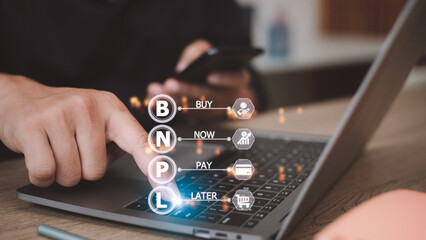 Businessmen holding a smartphone with icons of BNPL with online shopping icons technology. BNPL Buy now pay later online shopping concept.