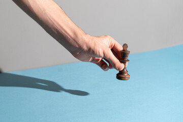 checkmate player holding a chess piece
