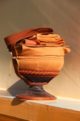Monk's alms bowl: Put it on the table to offer food to monks at the funeral according to Thai...