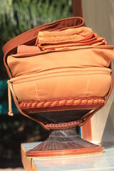 Monk's alms bowl: Put it on the table to offer food to monks at the funeral according to Thai tradition