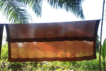 crumpled yellow monk robe, Yellow robe (of a Buddhist monk or novice); any of the three garments of the monk.