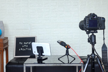 Podcast shooting equipment for home studio with a single-lens camera, microphone and gadget