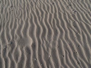 Fototapeta na wymiar Sand patterns wavy ripples