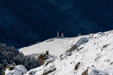 View of Salgi towers from Tsey Loam pass on sunny winter day. Ingushetia, Caucasus, Russia.
