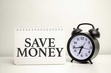 save money words with calculator and clock with notebook