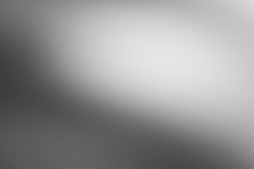 Dark black and gray blurred background has a little abstract light. soft background for...