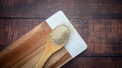 spoon of seasoning on wood background, food background, ingredient, sweet, sugar, brown sugar