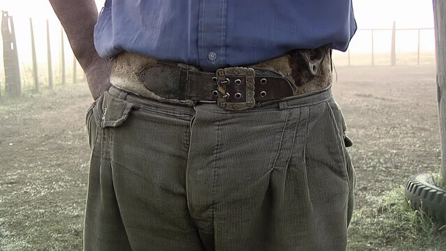 Midsection View of a Gaucho While Smoking in the Countryside, Uruguay, South America. Close Up. 4K Resolution.