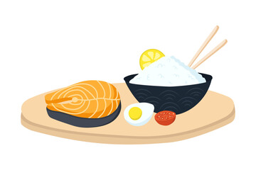 Salmon steak and boiled rice on a wooden tray