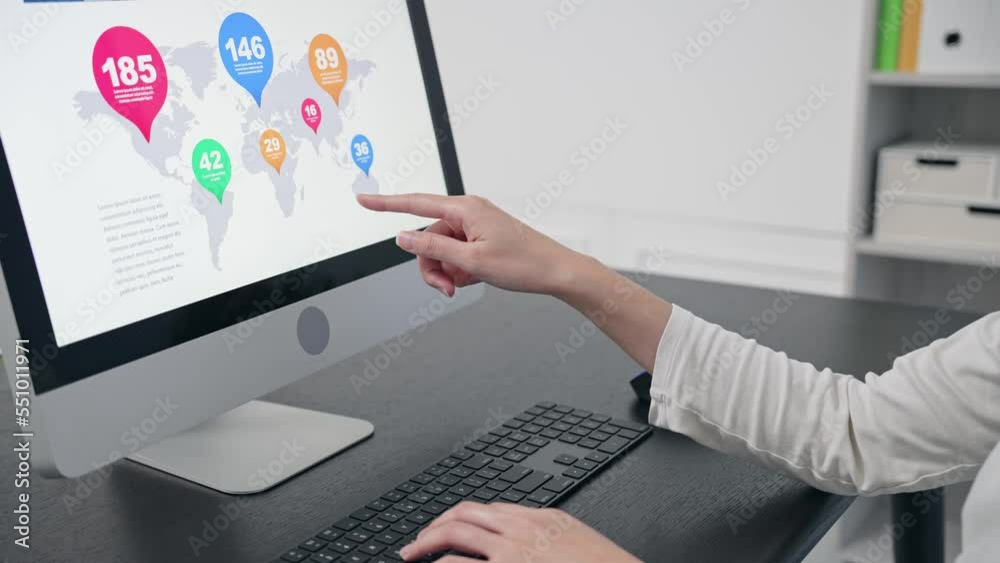 Poster close-up of a woman's hand using a desktop computer in the office.
