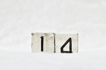 14 calendar date number, white snowy winter background copy space