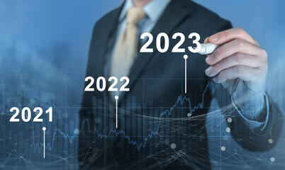 Development of successful economic growth in 2022, 2023 concept. Businessman forecast analysis plan...